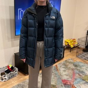 The North Face blue long jacket size L.